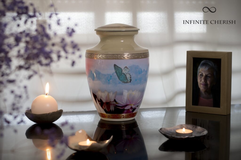 memorial table with a cremation urn of a butterfly with blue and yellow colors and a picture of my loved one